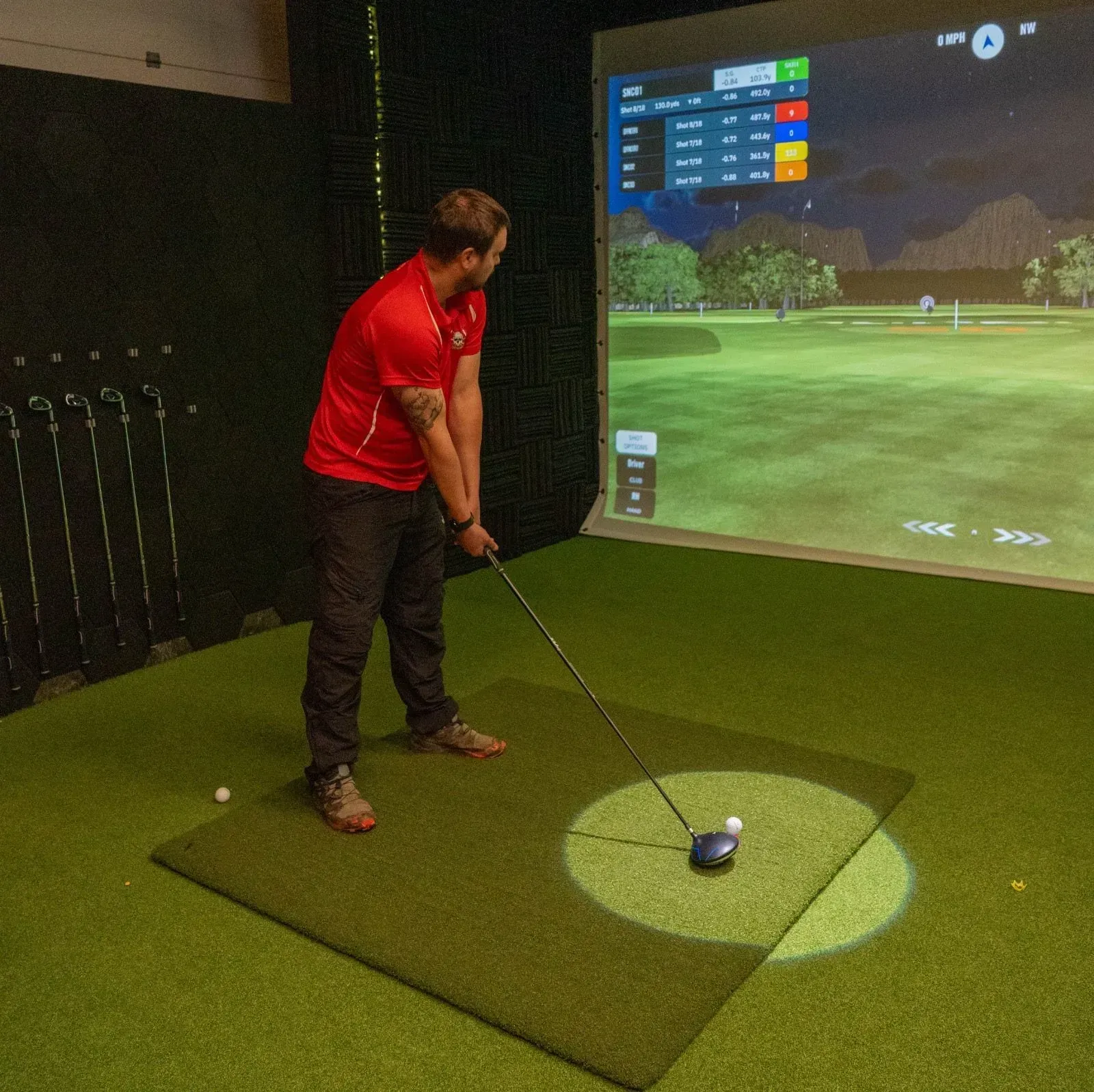 A golfer lining up a shot on the simulator at Virtual Fairways, Darlington
